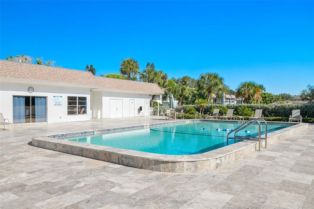597 Sutton Place Longboat Key, FL 34228 - Photo 34 of 49 a view of a house with swimming pool