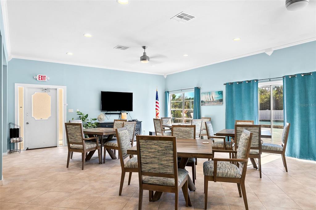 597 Sutton Place Longboat Key, FL 34228 - Photo 35 of 49 a view of a dining room with furniture window and wooden floor