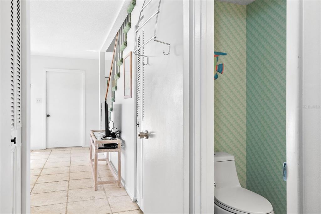 597 Sutton Place Longboat Key, FL 34228 - Photo 4 of 49 a bathroom with a toilet and a shower