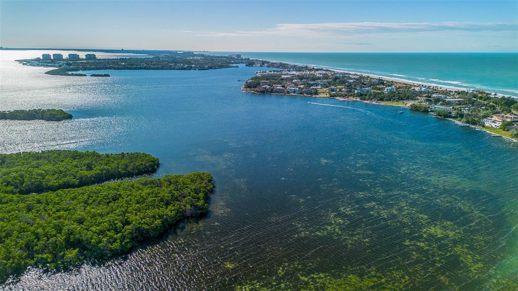 597 Sutton Place Longboat Key, FL 34228 - Photo 41 of 49 a view of a lake with a city