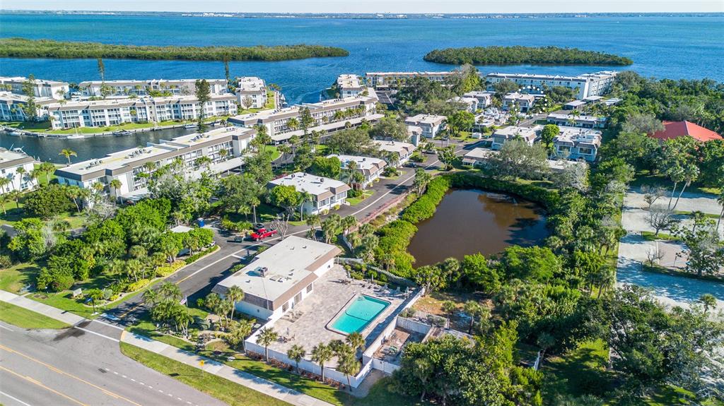 597 Sutton Place Longboat Key, FL 34228 - Photo 47 of 49 an aerial view of lake and residential houses with outdoor space
