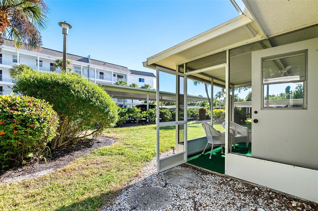 597 Sutton Place Longboat Key, FL 34228 - Photo 8 of 49 a view of an house with backyard and balcony