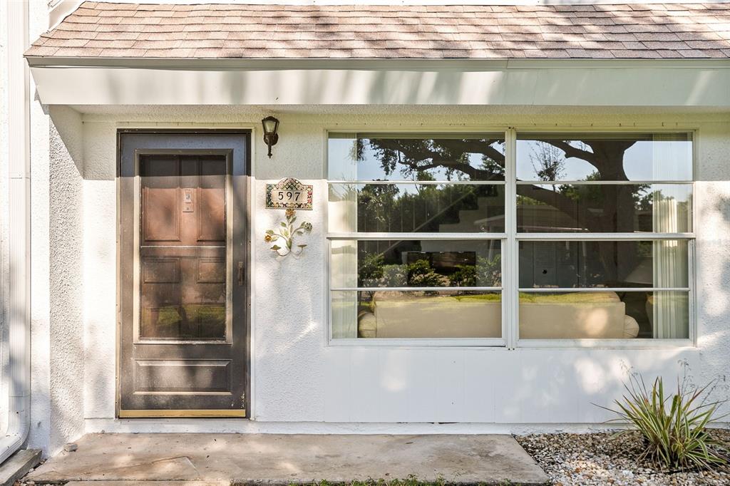 597 Sutton Place Longboat Key, FL 34228 - Photo 9 of 49 a view of a wooden door
