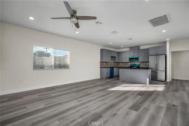 a view of kitchen with wooden floor and window