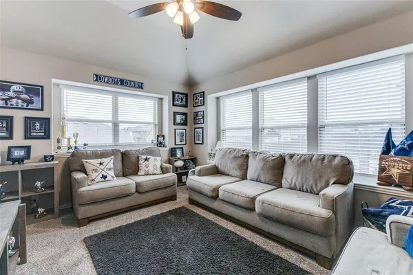 a living room with furniture and a large window