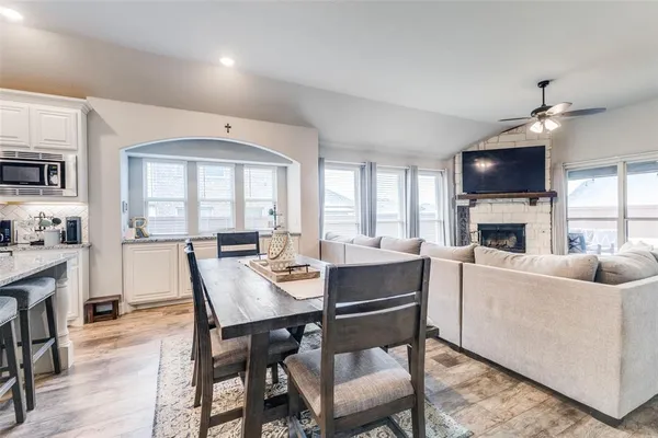 a living room with furniture fireplace and a flat screen tv