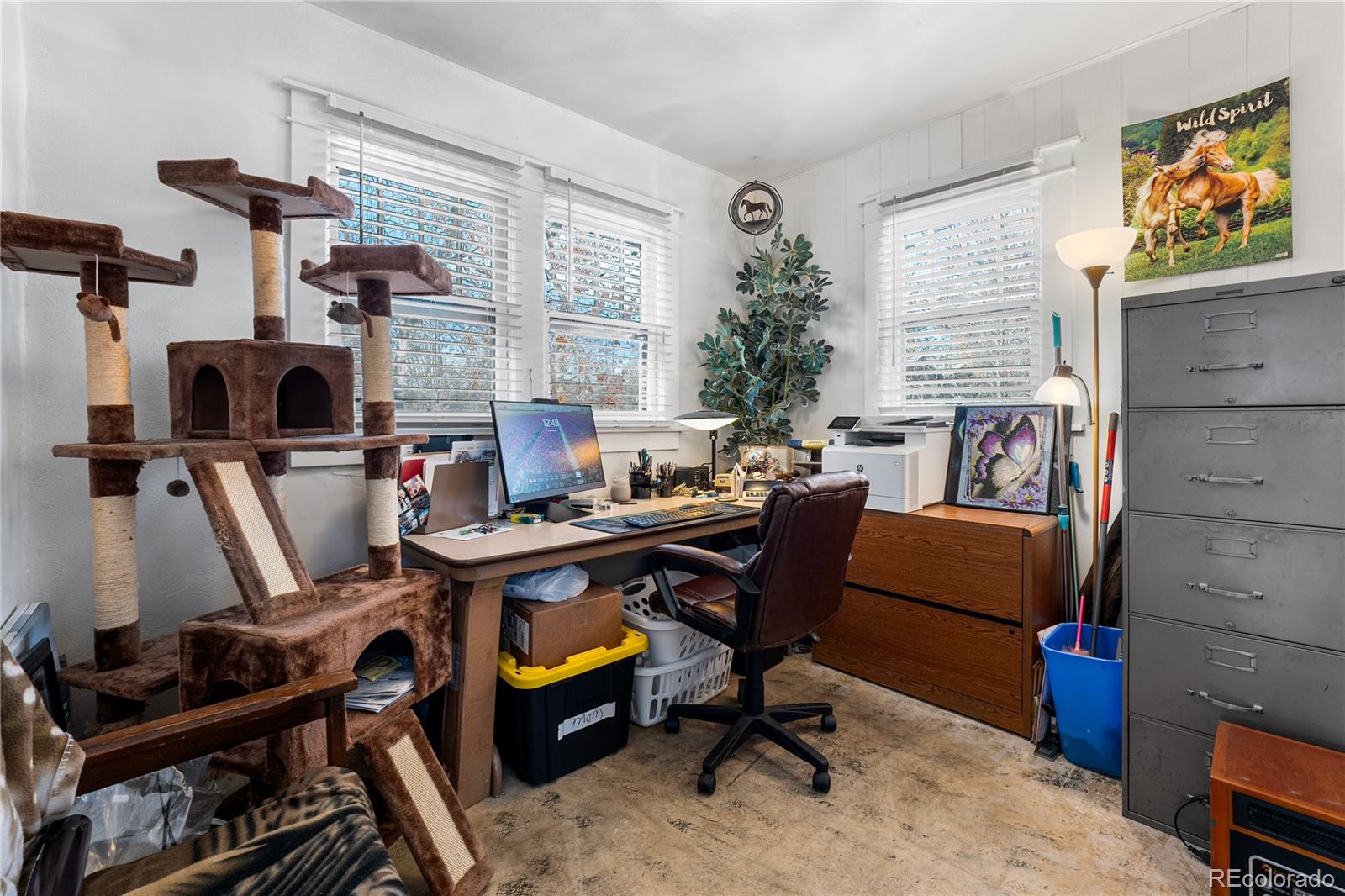 6145 West 38th Avenue Wheat Ridge, CO 80033 - Photo 21 of 39 a view of a workspace with furniture and a window