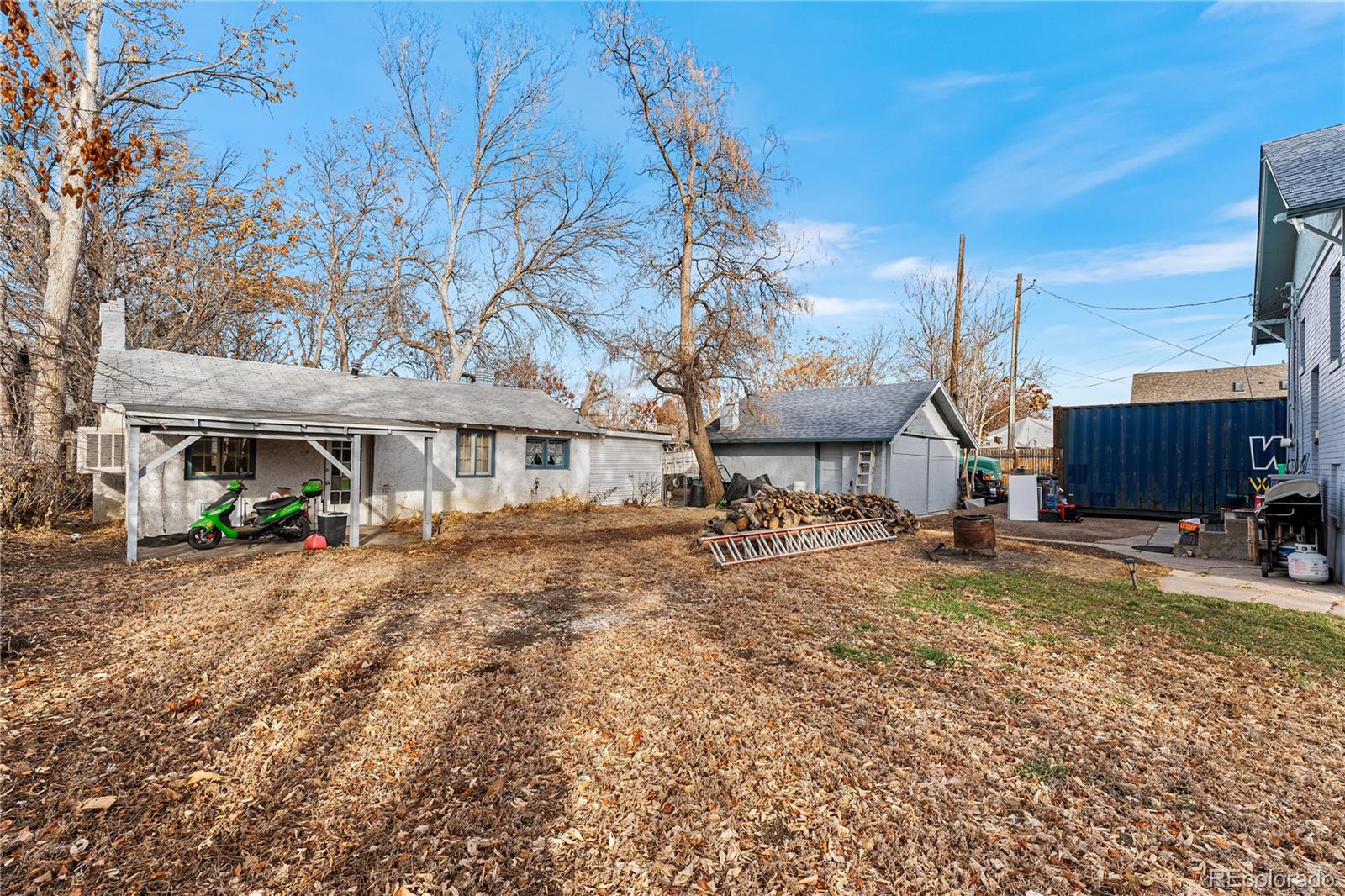 6145 West 38th Avenue Wheat Ridge, CO 80033 - Photo 23 of 39 a view of a house with a yard