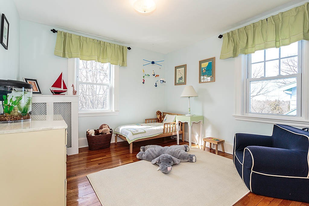40 Kilsythe Road Arlington, MA 02476 - Photo 11 of 16 a bedroom with furniture and a window