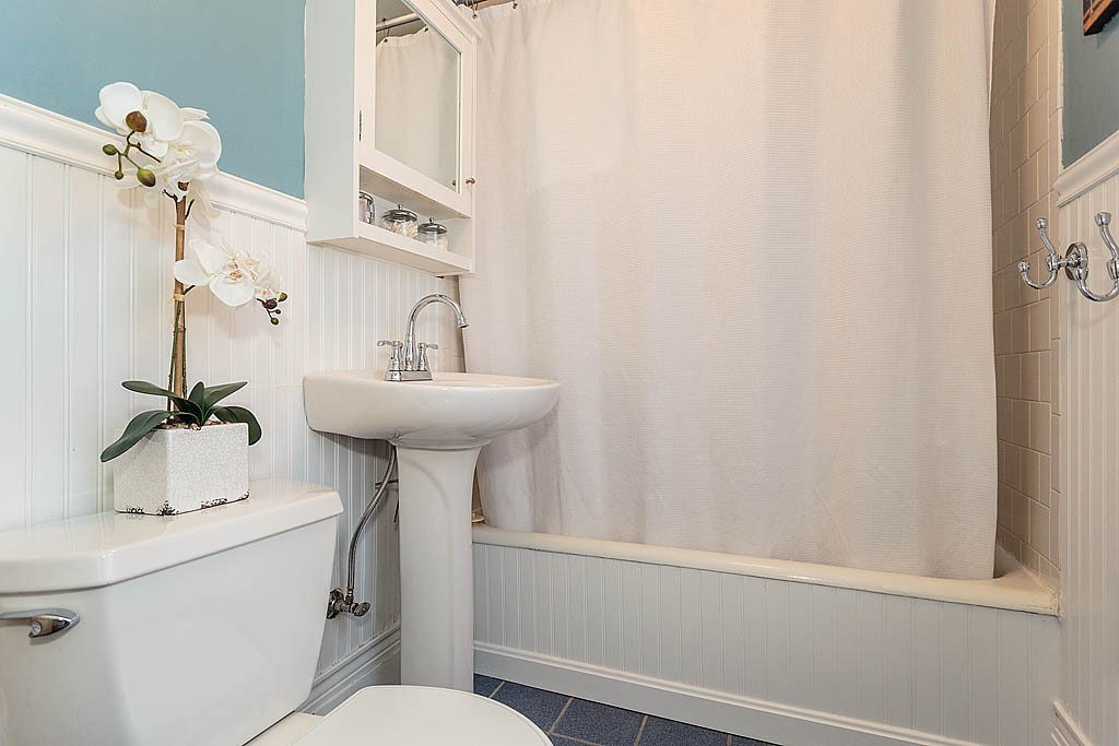 40 Kilsythe Road Arlington, MA 02476 - Photo 13 of 16 a bathroom with a sink a mirror and a toilet