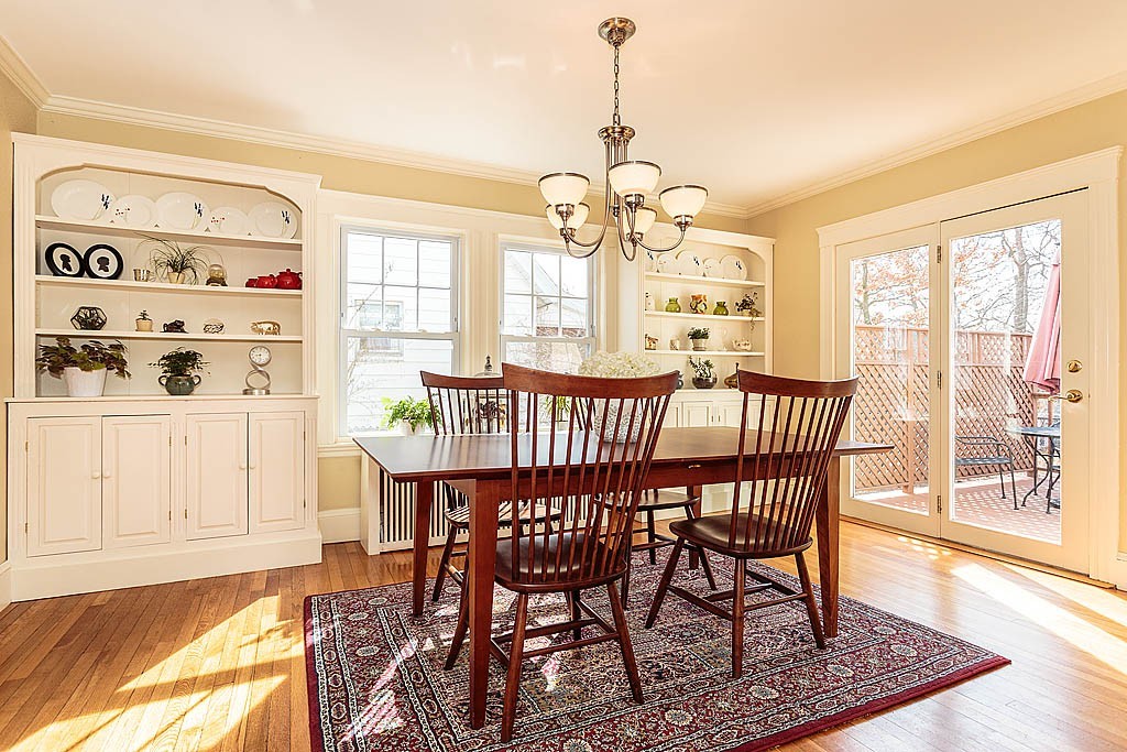 40 Kilsythe Road Arlington, MA 02476 - Photo 5 of 16 a view of a dining room with furniture wooden floor and chandelier