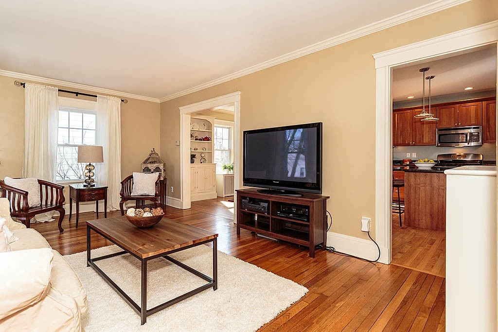 40 Kilsythe Road Arlington, MA 02476 - Photo 6 of 16 a living room with furniture a flat screen tv and wooden floor