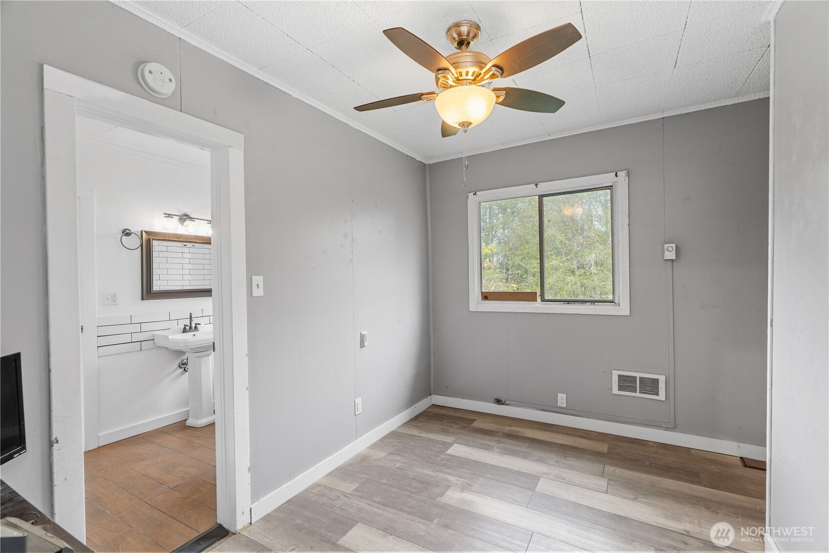2405 1st Street Cosmopolis, WA 98537 - Photo 12 of 36 a view of a livingroom with a chandelier fan and a fireplace
