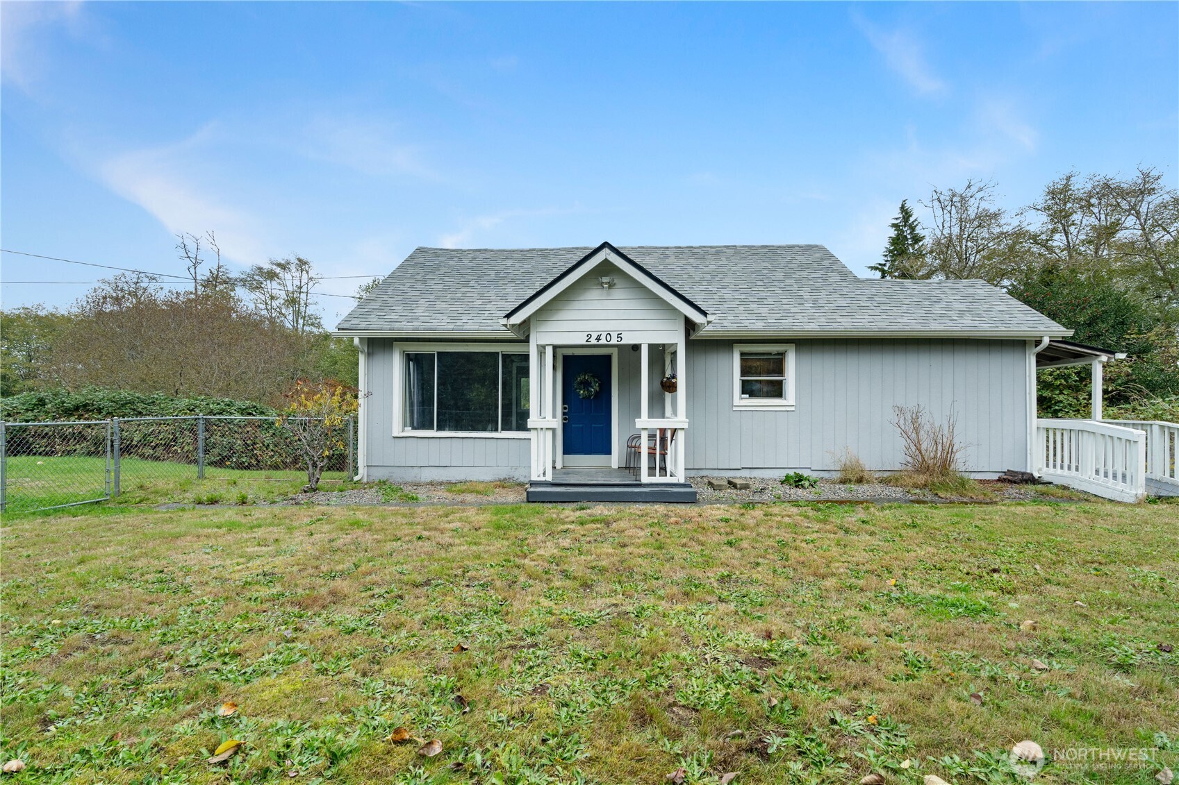2405 1st Street Cosmopolis, WA 98537 - Photo 2 of 36 a front view of a house with a garden