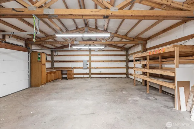 a front view of a house with yard and green space