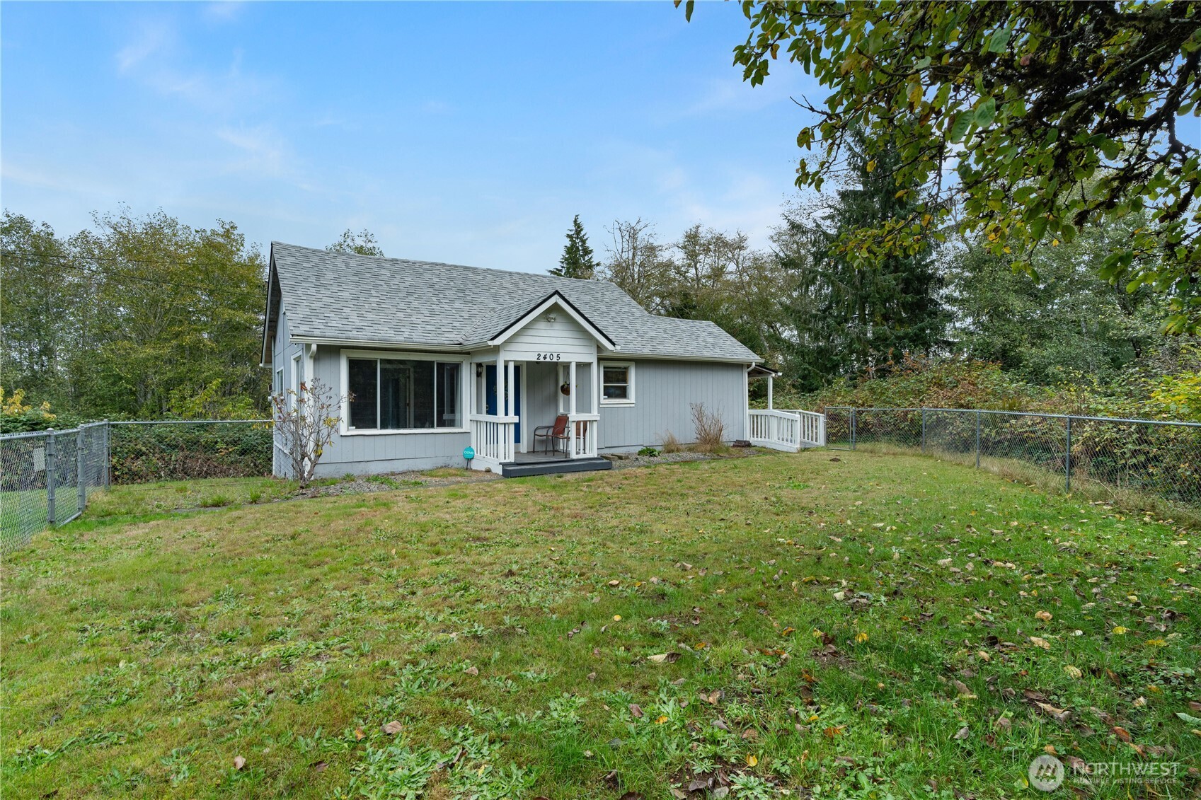 2405 1st Street Cosmopolis, WA 98537 - Photo 26 of 36 a front view of a house with yard and green space