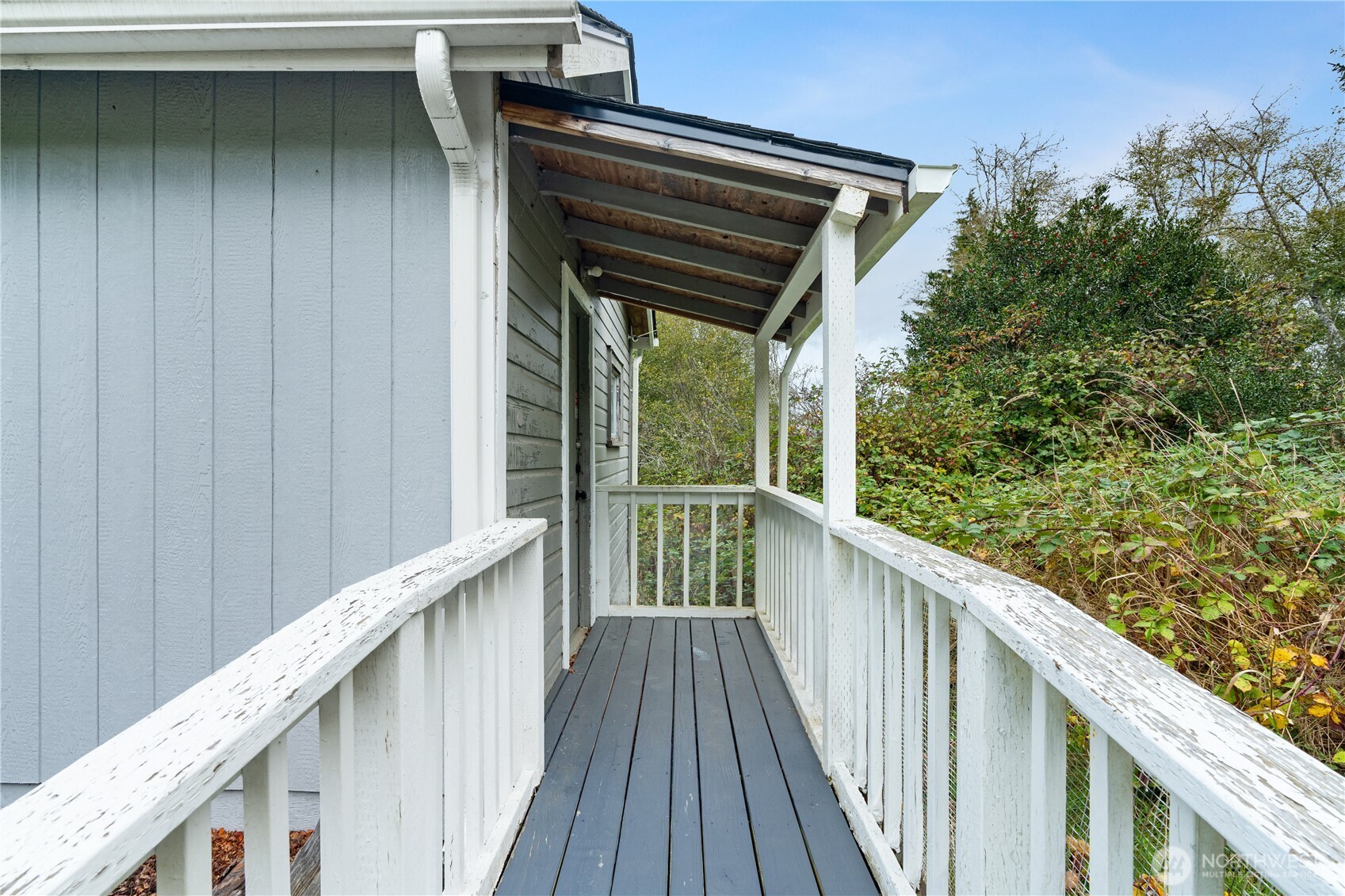 2405 1st Street Cosmopolis, WA 98537 - Photo 4 of 36 a view of a balcony with wooden floor and fence