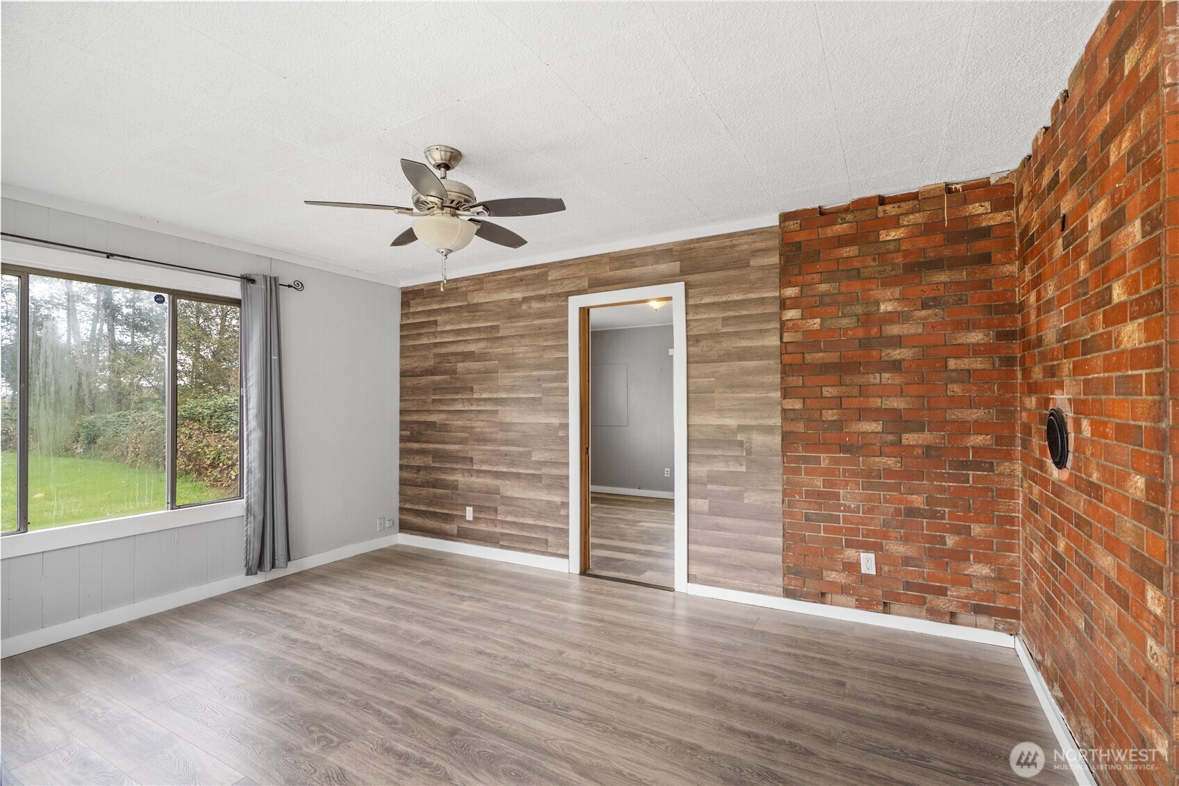 2405 1st Street Cosmopolis, WA 98537 - Photo 5 of 36 wooden floor in an empty room with a window