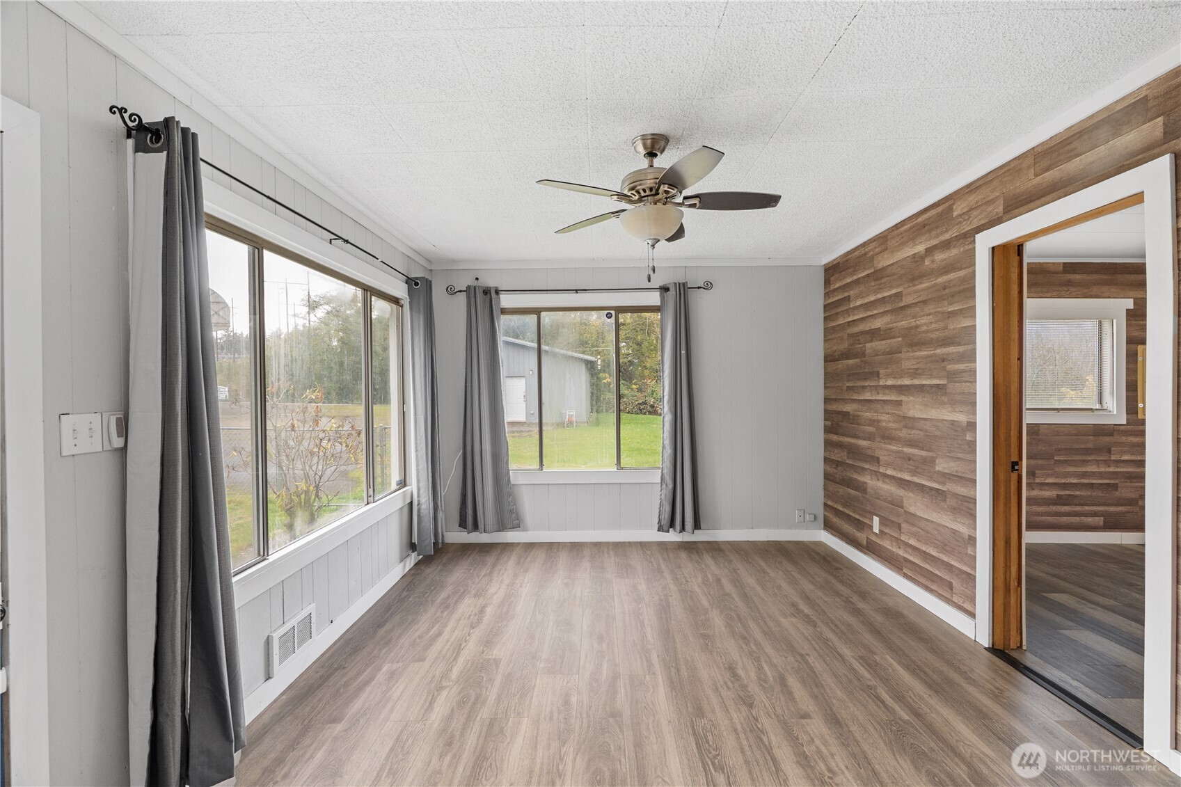 2405 1st Street Cosmopolis, WA 98537 - Photo 6 of 36 a view of empty room with wooden floor and fan