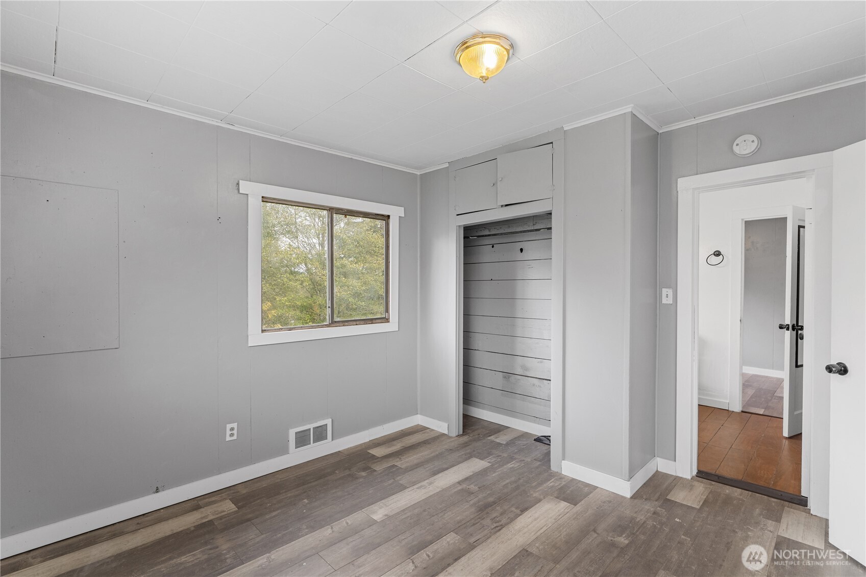 2405 1st Street Cosmopolis, WA 98537 - Photo 9 of 36 an empty room with windows and entrance