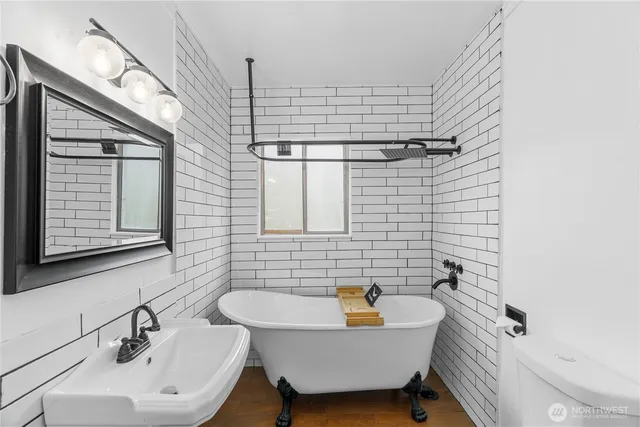 a bathroom with a sink and mirror