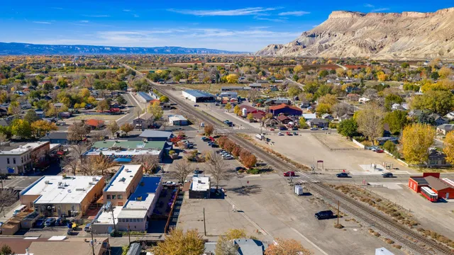 an aerial view of residential houses with outdoor space