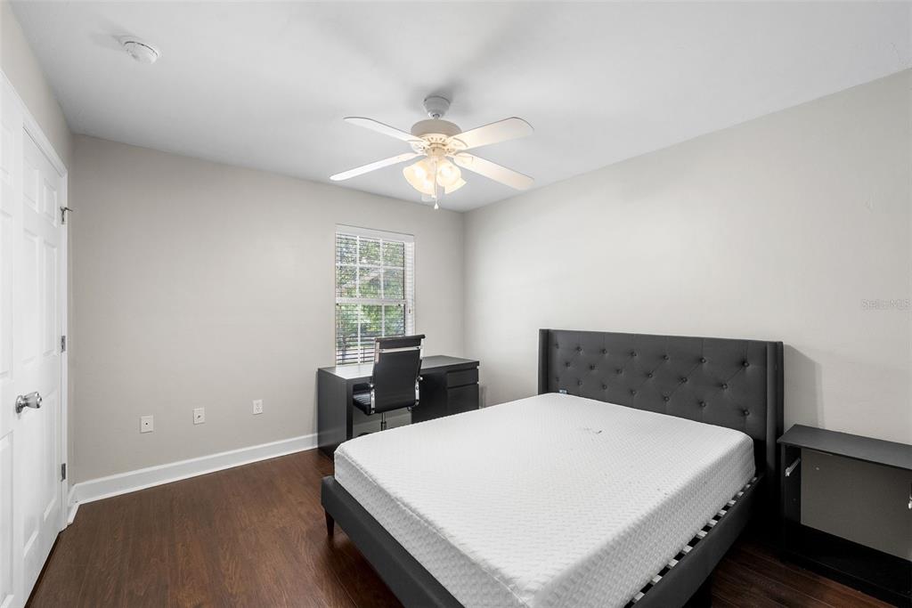 2927 Southwest 35th Place, Unit 113 Gainesville, FL 32608 - Photo 17 of 27 a bedroom with a bed and a window