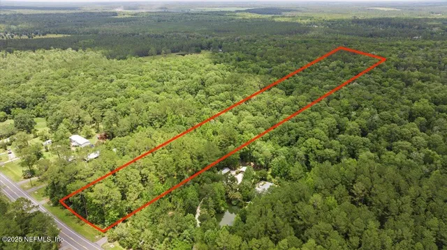 a view of a field with an ocean