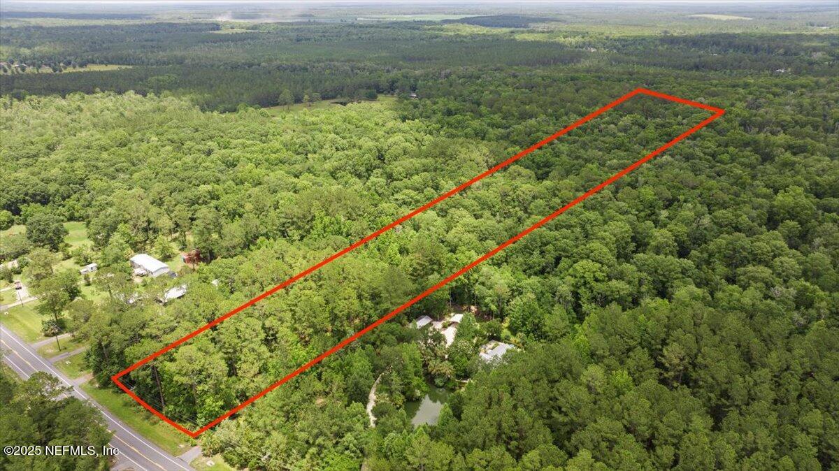 a view of a field with an ocean