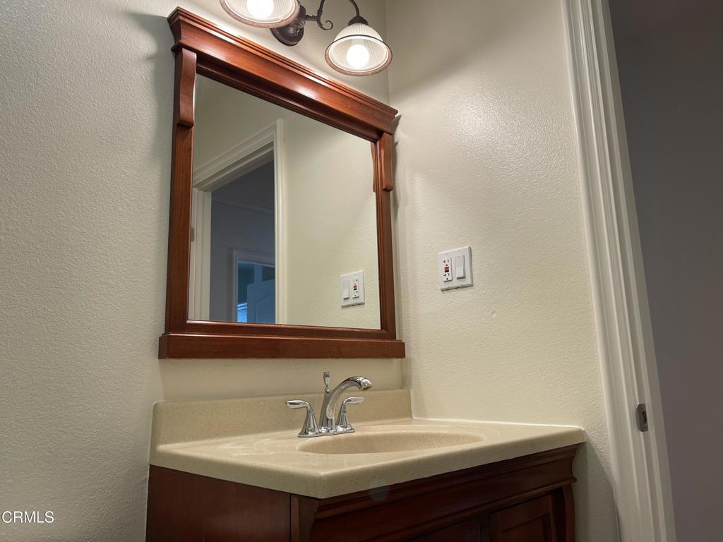3226 La Crescenta Avenue Glendale, CA 91208 - Photo 13 of 18 a bathroom with a sink and a mirror