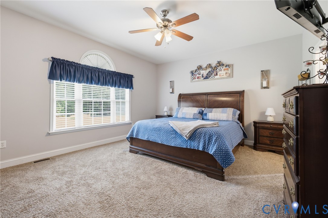 9433 Robin Road Disputanta, VA 23842 - Photo 20 of 26 Carpeted room featuring a large window with an arc