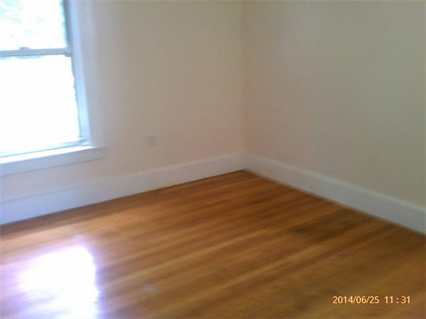 115 Ryan Road Northampton, MA 01062 - Photo 6 of 10 an empty room with wooden floor and windows
