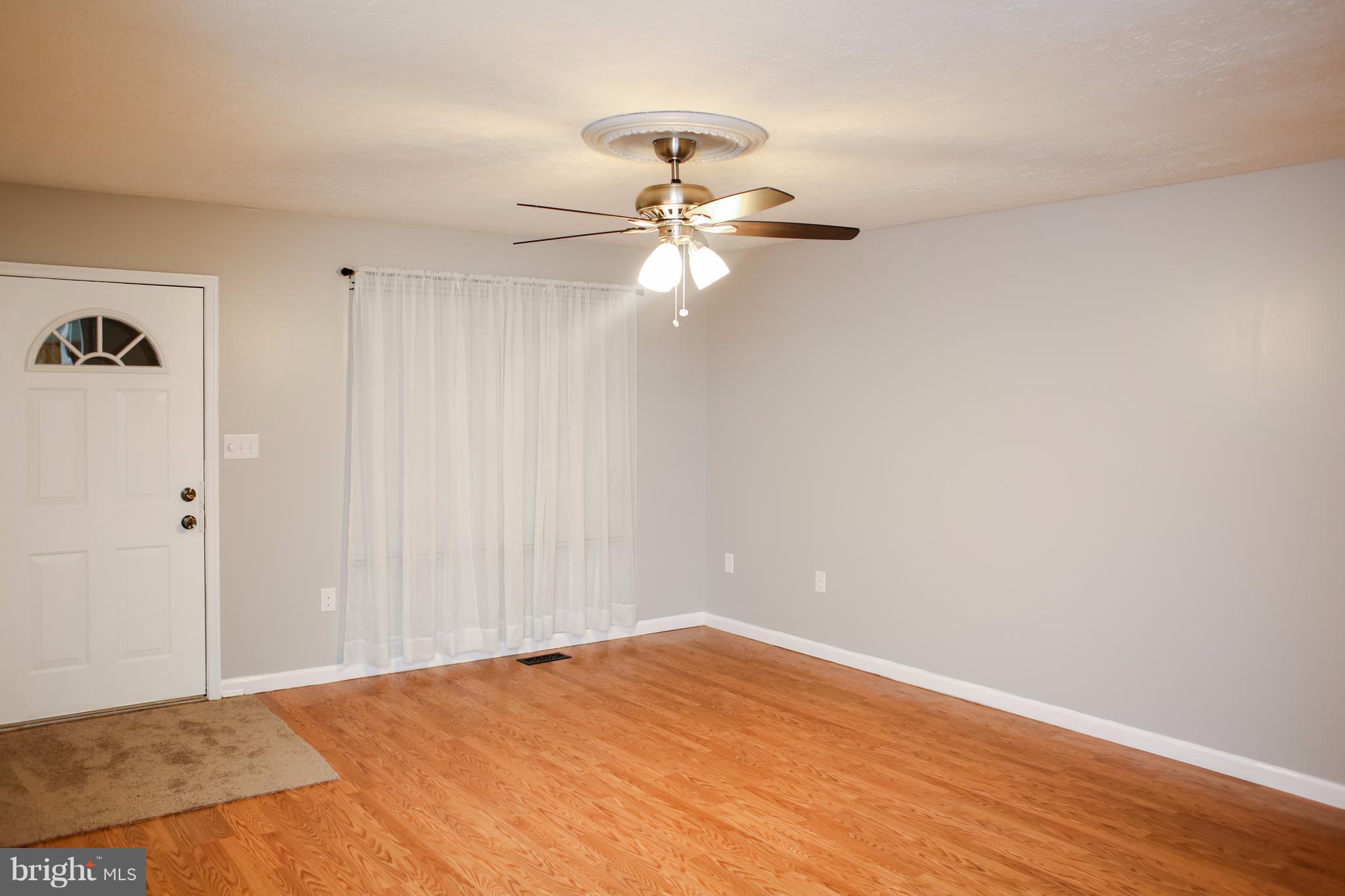 503 Burns Street Ranson, WV 25438 - Photo 2 of 15 a view of empty room with wooden floor