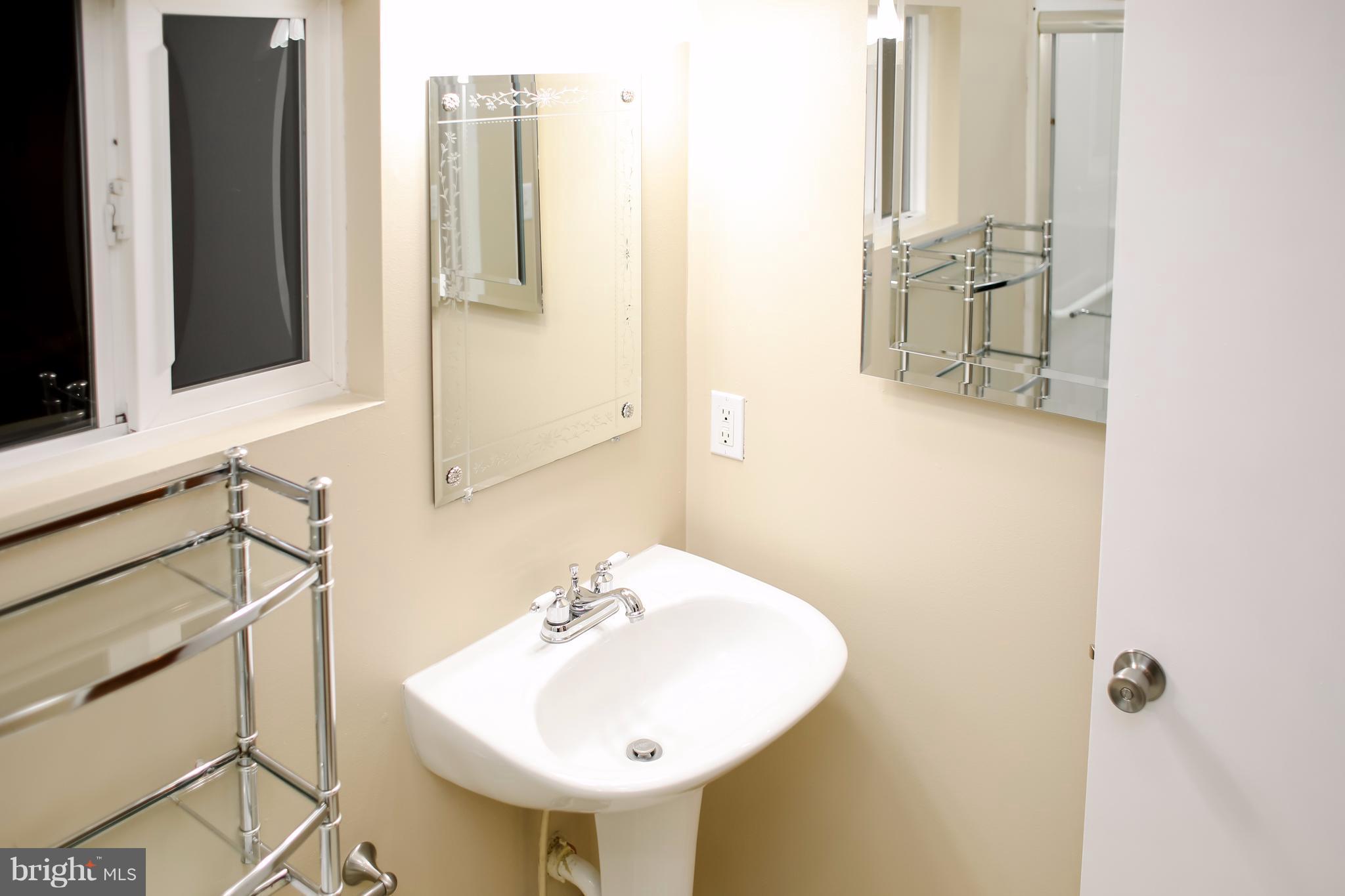 503 Burns Street Ranson, WV 25438 - Photo 11 of 15 a bathroom with a sink and a mirror
