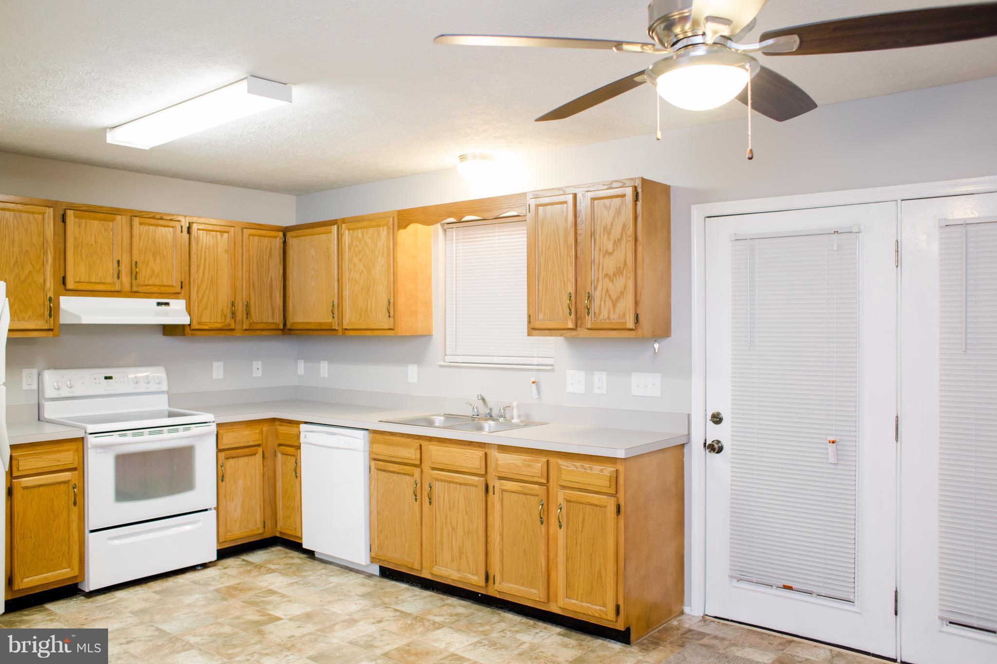 503 Burns Street Ranson, WV 25438 - Photo 3 of 15 a kitchen with a sink cabinets and window