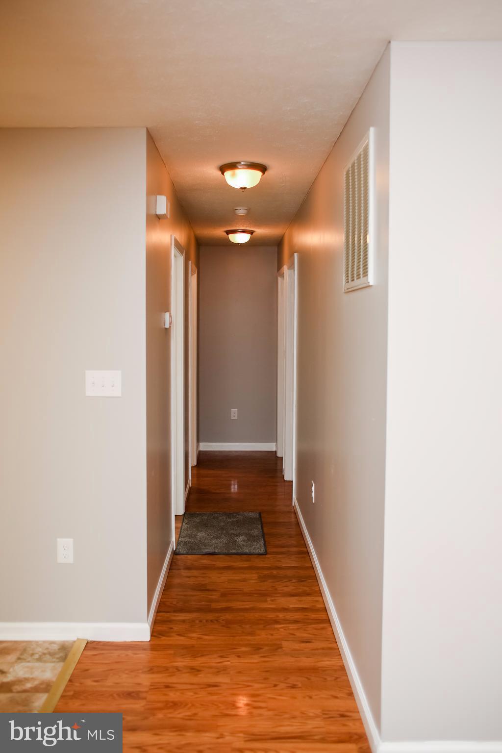 503 Burns Street Ranson, WV 25438 - Photo 5 of 15 a view of a hallway with wooden floor