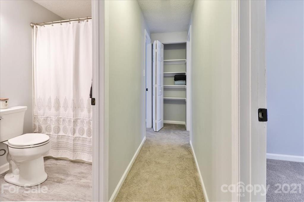 6636 Piney Path Road Charlotte, NC 28212 - Photo 14 of 24 a bathroom with a toilet and a shower