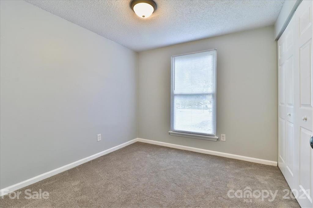 6636 Piney Path Road Charlotte, NC 28212 - Photo 15 of 24 an empty room with a window