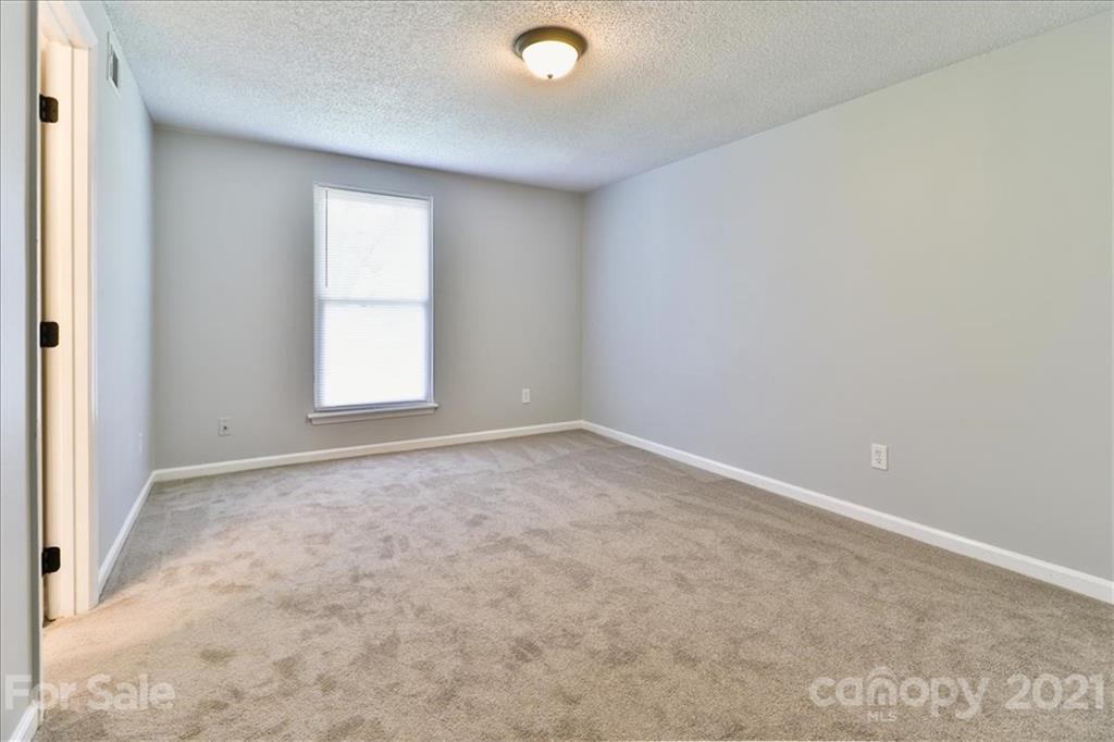 6636 Piney Path Road Charlotte, NC 28212 - Photo 17 of 24 an empty room with windows