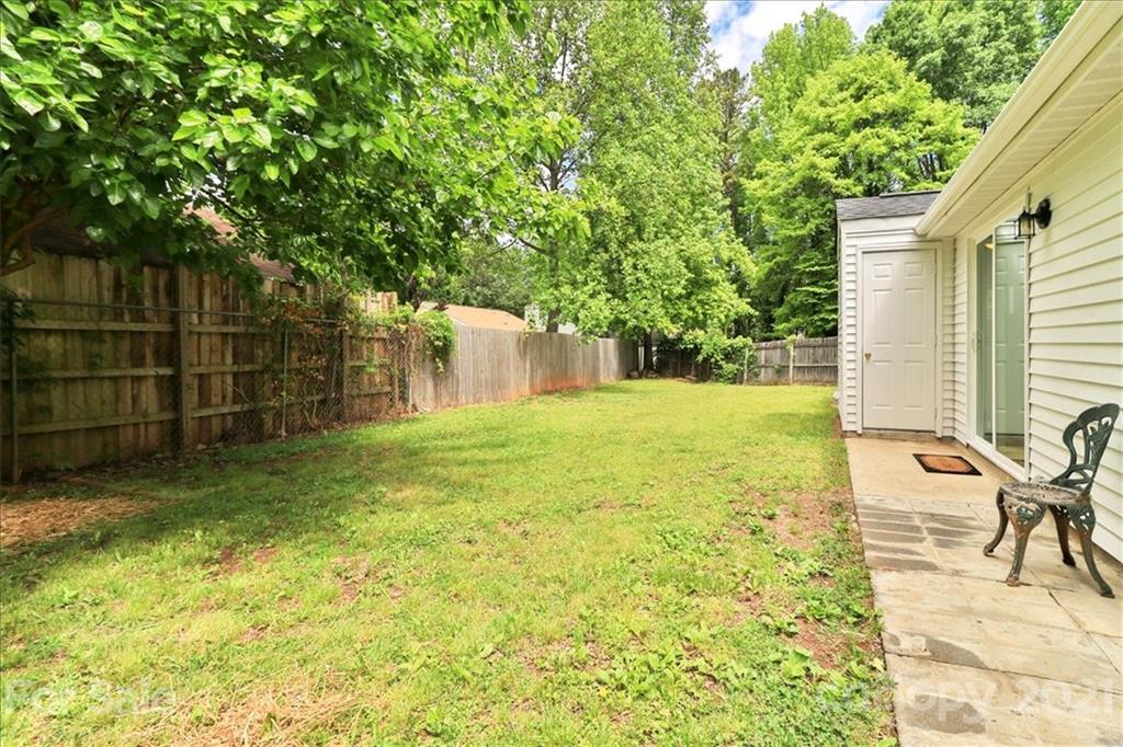 6636 Piney Path Road Charlotte, NC 28212 - Photo 21 of 24 a backyard of a house with table and chairs