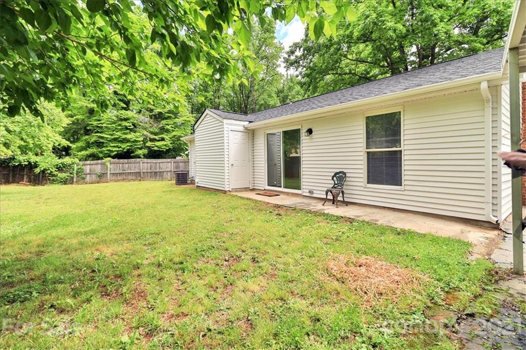 6636 Piney Path Road Charlotte, NC 28212 - Photo 22 of 24 a backyard of a house with yard and garage