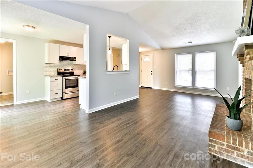 6636 Piney Path Road Charlotte, NC 28212 - Photo 8 of 24 a view of a kitchen cabinets and wooden floor