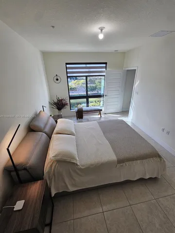 a bed room with a bed and a couch