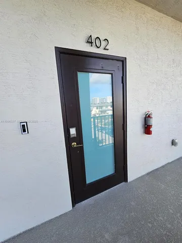 a kitchen with stainless steel appliances kitchen island granite countertop a refrigerator and a stove