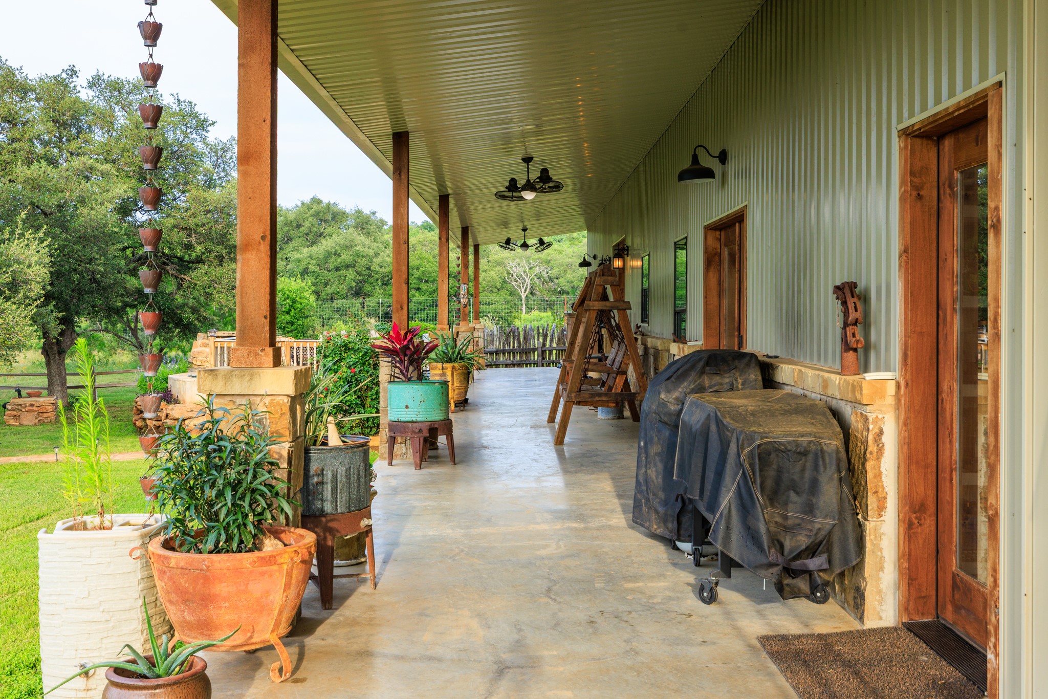 3724 Ranch Road 3347 Round Mountain, TX 78663 - Photo 21 of 40 a living room filled with furniture and a potted plant