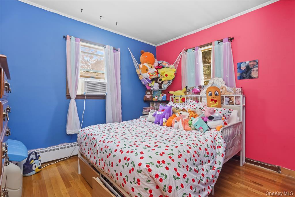 36 Edgewood Road Cortlandt Manor, NY 10567 - Photo 14 of 22 Bright and cheerful bedroom featuring hardwood floors and natural light.