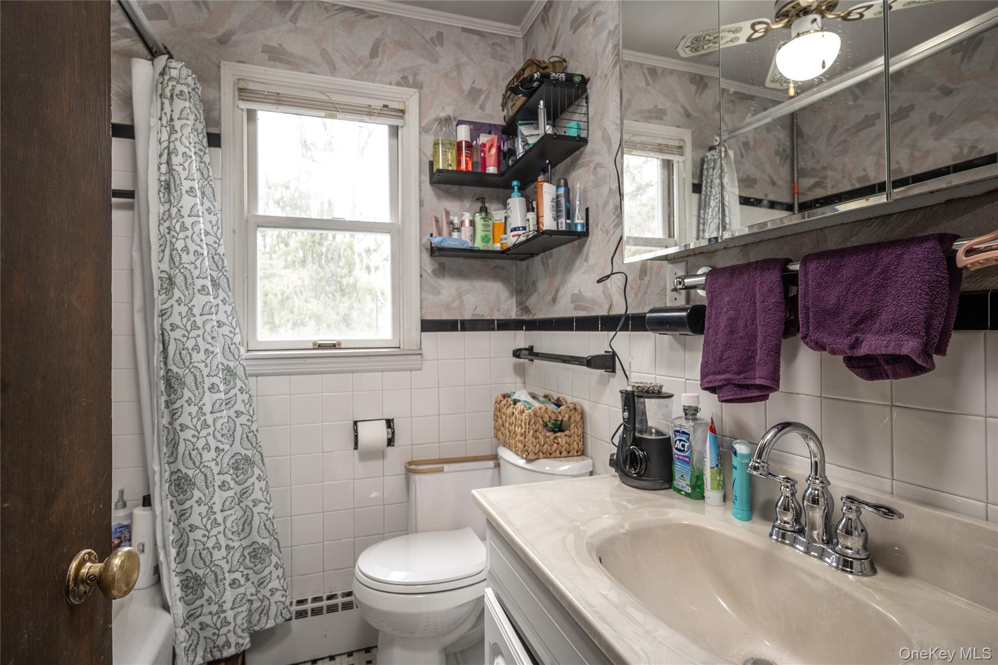 36 Edgewood Road Cortlandt Manor, NY 10567 - Photo 15 of 22 Full bathroom on first floor with tub/shower combo and natural light.