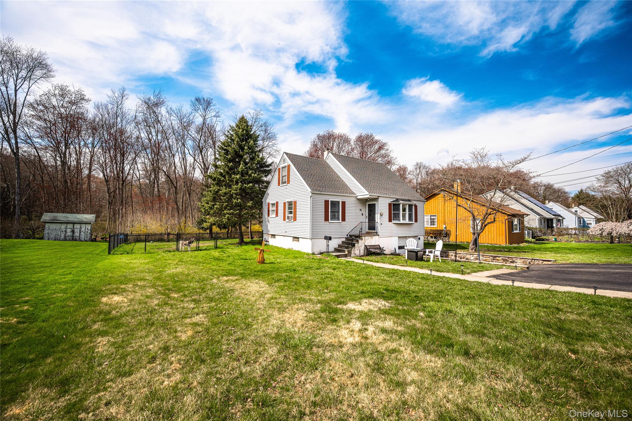 36 Edgewood Road Cortlandt Manor, NY 10567 - Photo 2 of 22 Expansive front and side yard offering additional outdoor space, perfect for recreation, gardening, or future customization.