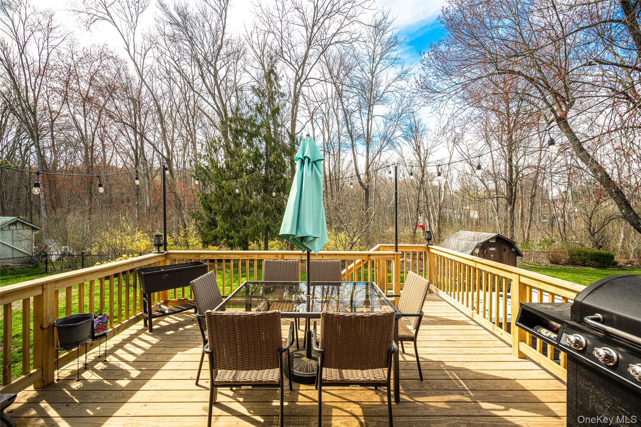 36 Edgewood Road Cortlandt Manor, NY 10567 - Photo 22 of 22 Inviting elevated deck perfect for outdoor dining and entertaining, featuring ample seating space and scenic views of the private backyard.