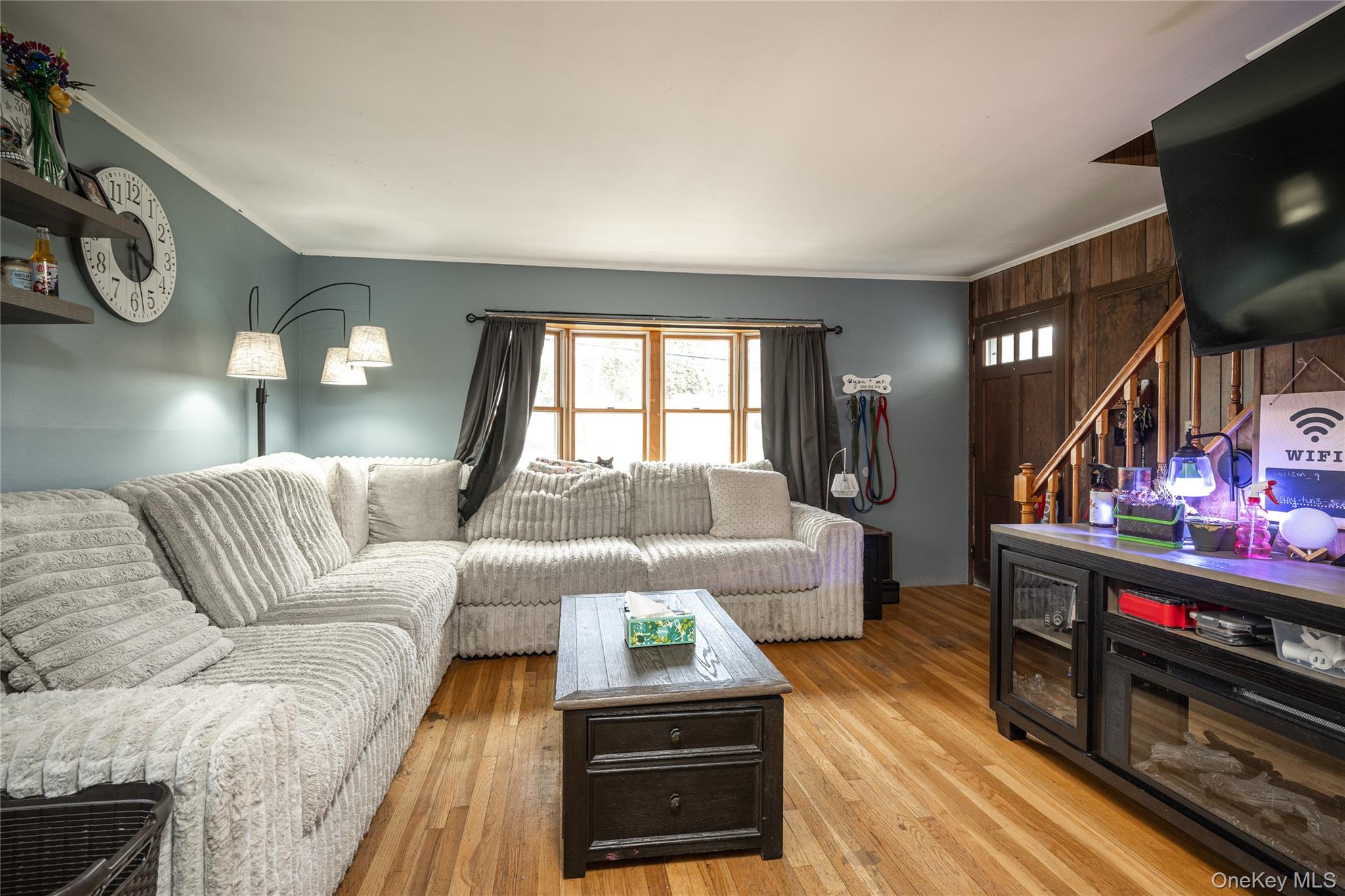 36 Edgewood Road Cortlandt Manor, NY 10567 - Photo 5 of 22 Living room with hardwood floors, large windows, and abundant natural light.